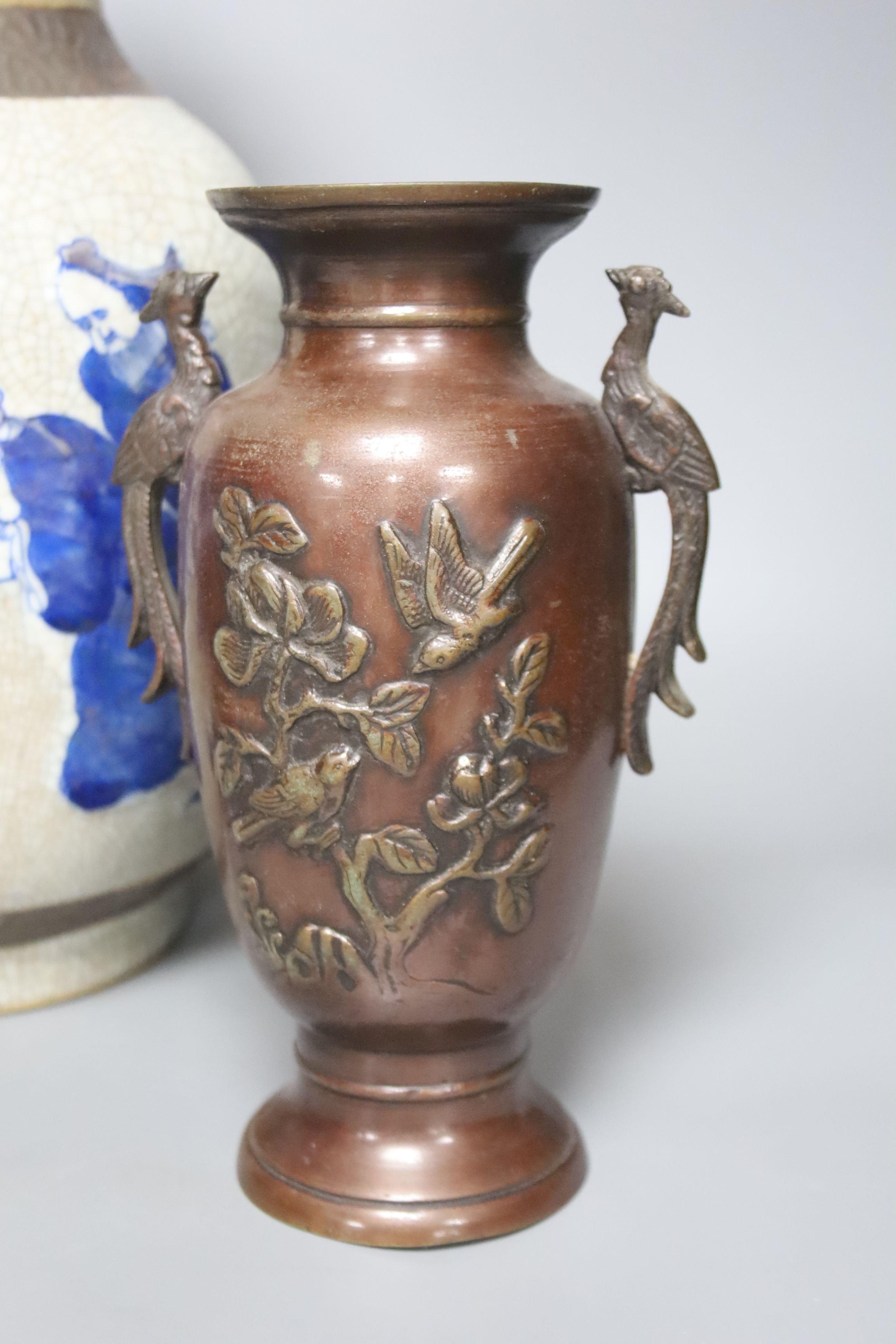 A Chinese blue and white crackle glaze vase, a similar cloisonne vase and a bronze vase, tallest 38cm